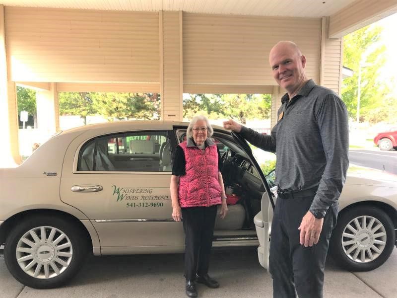 Senior enjoying safe transportation at Twin Creeks Retirement, supporting independence and mobility in Central Point, Oregon.